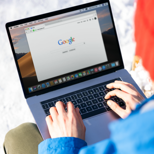 view of laptop screen on the Google search engine homepage